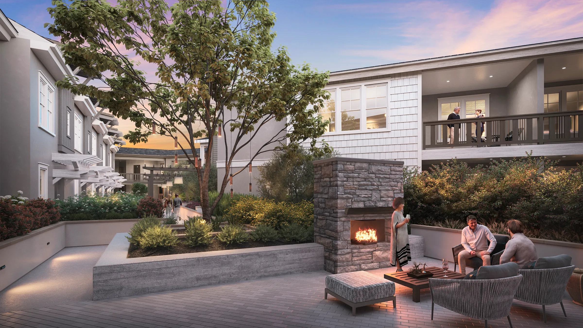 3D rendering of an outdoor courtyard lounge at 600 Hartz Avenue in Danville, with a stone fireplace, lounge chairs, and a residence balcony above at dusk.