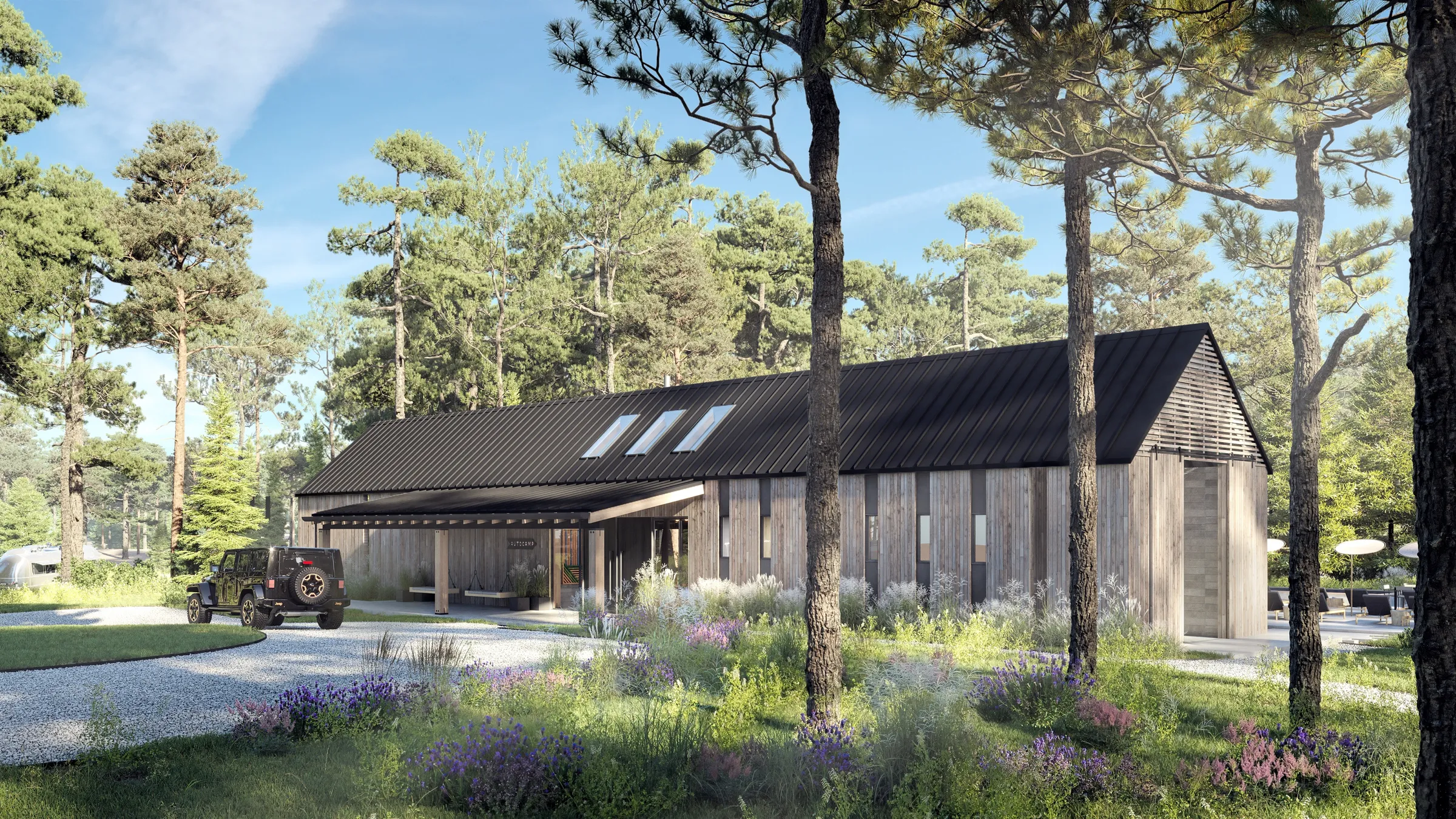 Daytime 3D rendering of the AutoCamp Catskills clubhouse, two gabled cedar-clad masses with dark standing-seam roofs and a covered entry, a Jeep on the gravel drive, set in a wildflower meadow among tall pines.
