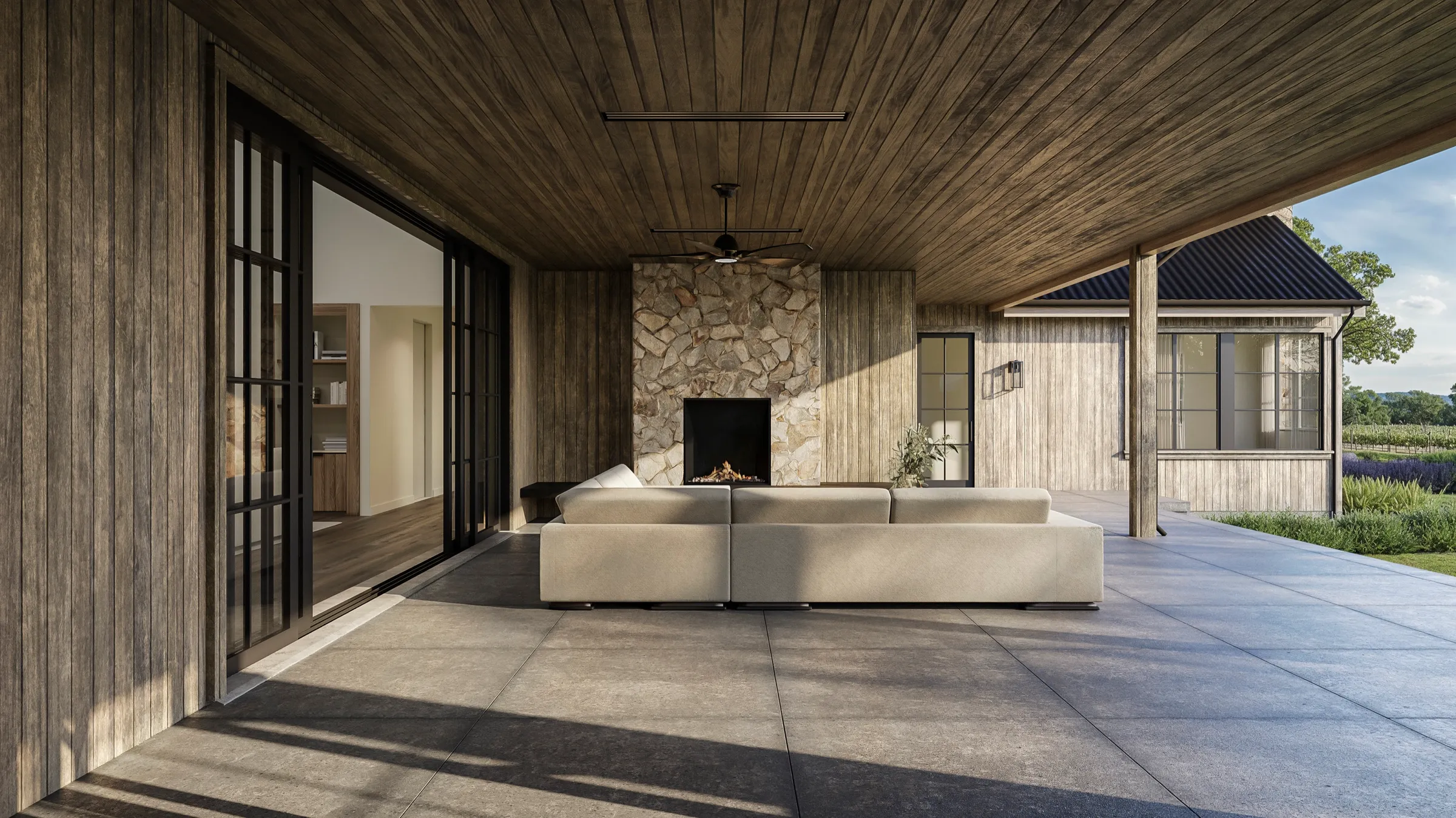 3D rendering of the loggia at a Napa Valley estate in St. Helena, a covered outdoor room with a board ceiling, a stone fireplace, a low sectional, and sliding glass to the interior on one side and the pool and vineyards on the other.