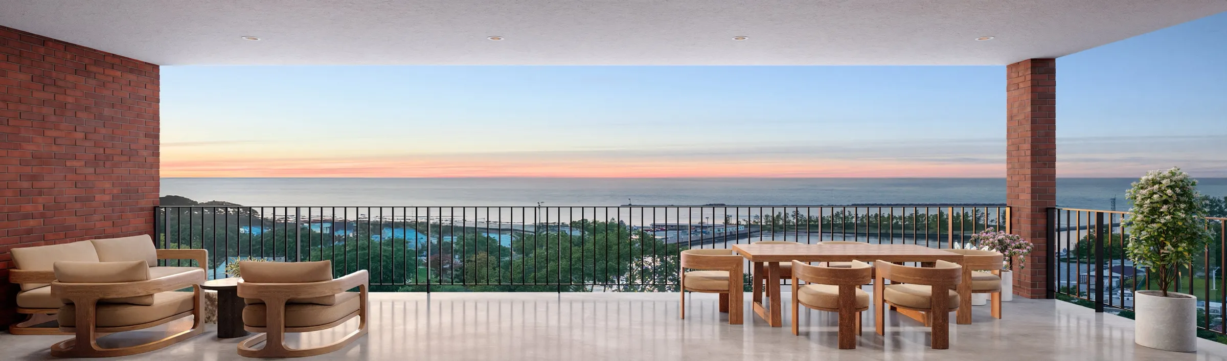 Sunset 3D rendering of the wraparound terrace of Residence 925 at SoLa in Michigan City, Indiana, with a lounge seating group on one side, a dining table on the other, brick columns, and a panoramic view of Lake Michigan.