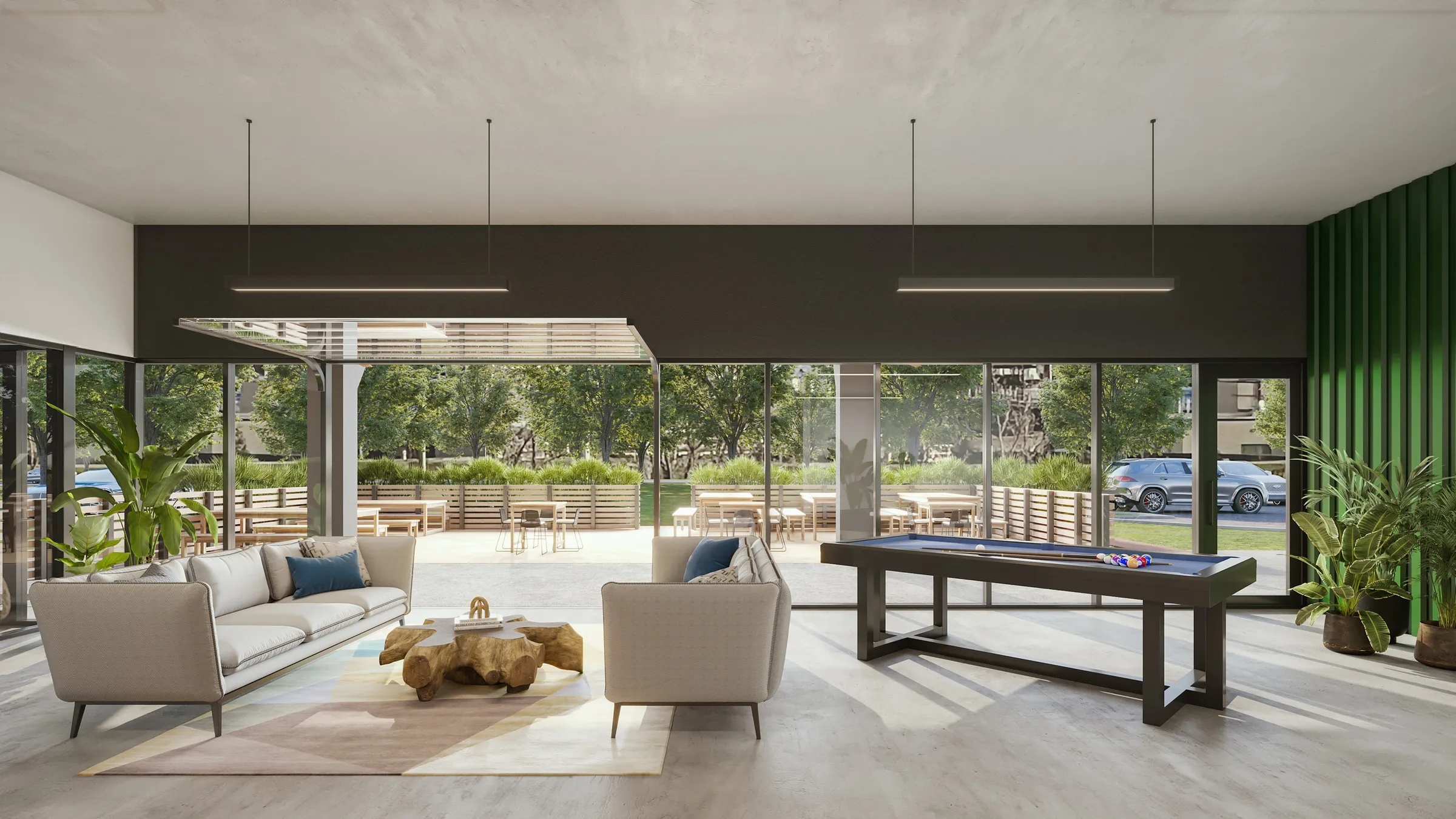 3D rendering of a ground-floor tenant lounge at The Ivy that opens through glass walls onto a landscaped patio, furnished with sofas, lounge chairs, and a shuffleboard table.
