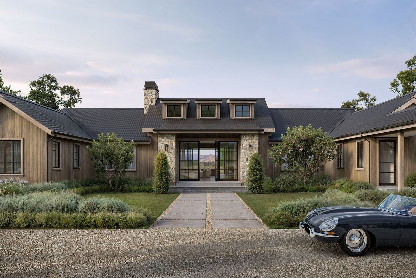 3D exterior rendering of a luxury residential house with stone entry, timber facade, landscaped garden, and vintage car
